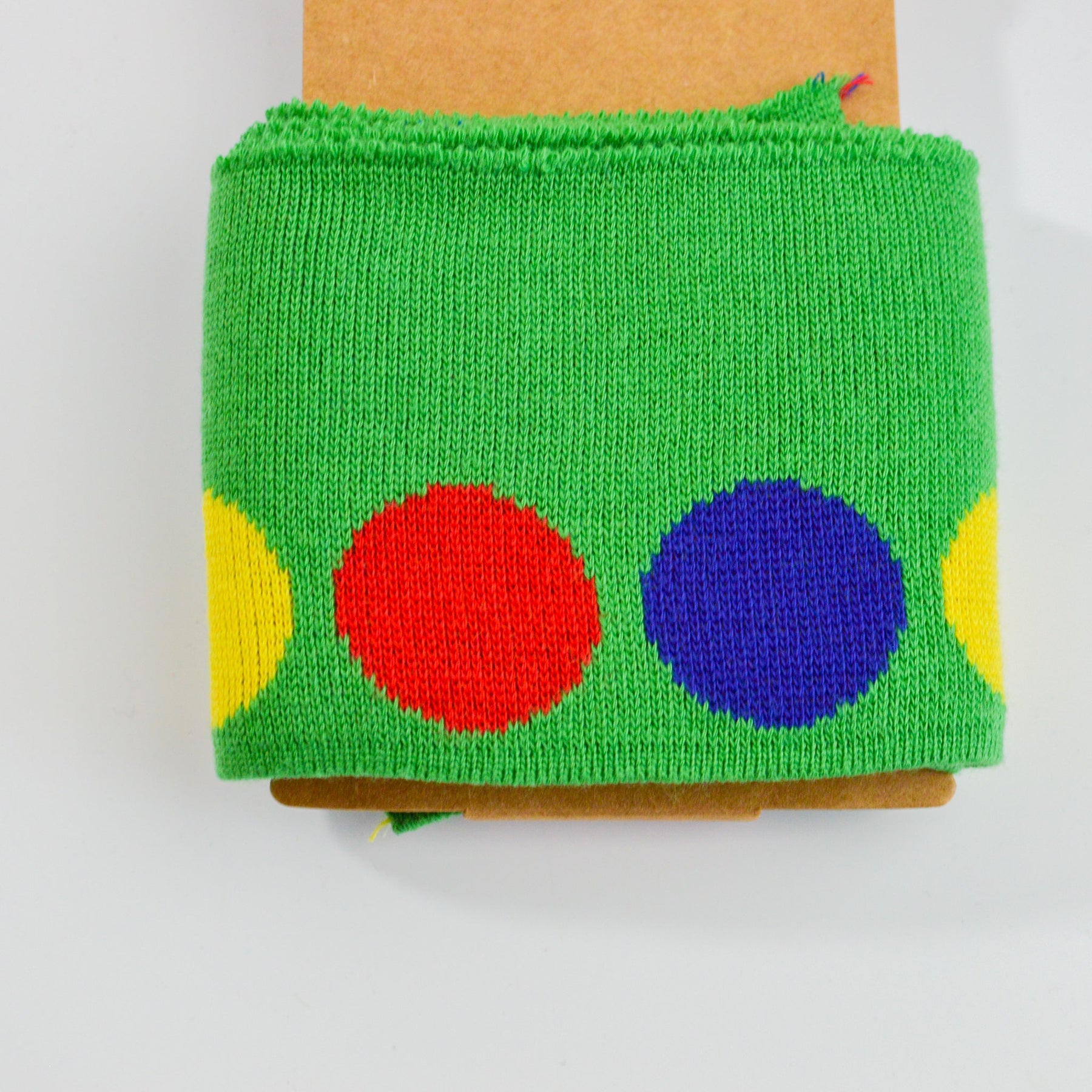 Cuff Jacquard Bündchen - bunte Punkte auf grasgrün Paket poshpinks