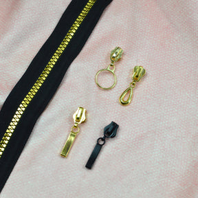 Endlosreißverschluss schwarz gold metallic - Meterware Fabric poshpinks